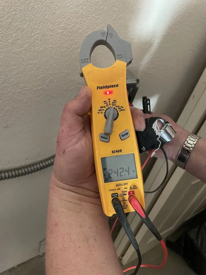 Voltage testing with clamp meter during Whole House Surge Protector in Danville